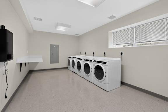 A laundry room with a washer and dryer.