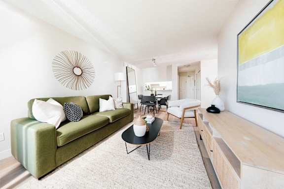 a living room with a green couch