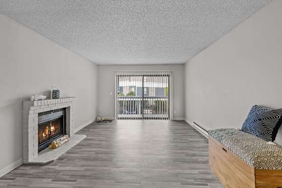 A room with a fireplace and a bed.