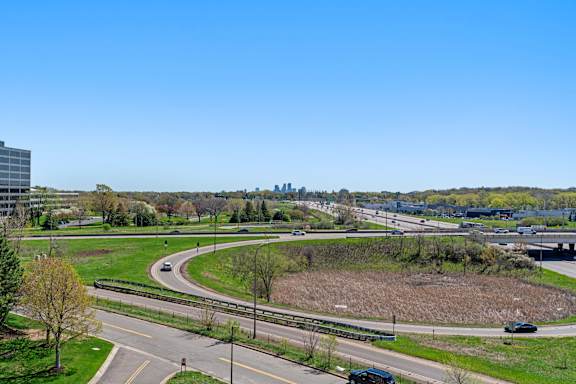 the view of the freeway and the city in the distance at The Mera, St Louis Park, MN