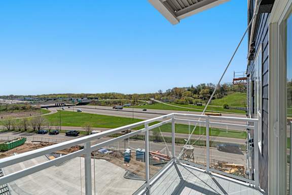 the view from the balcony of a building overlooking a construction site at The Mera, Minnesota