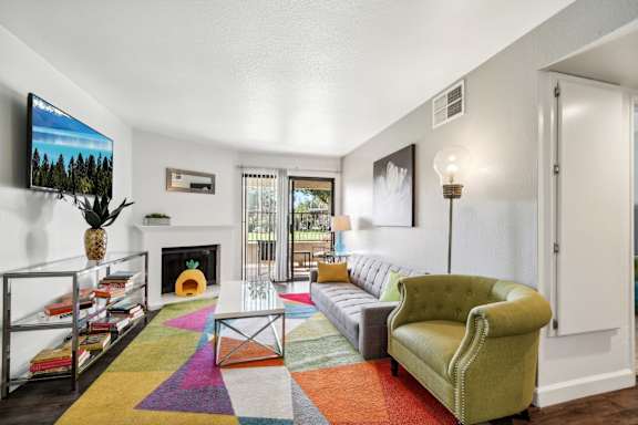 a living room with a couch and a fireplace