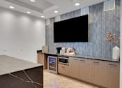 Thumbnail 30 of 33 - Coffee machine in clubhouse kitchen at AVIA Apartments On Alpha, Dallas, Texas