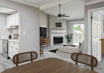 a living room with a couch coffee table and fireplace at Riverset Apartments, Memphis, 38103