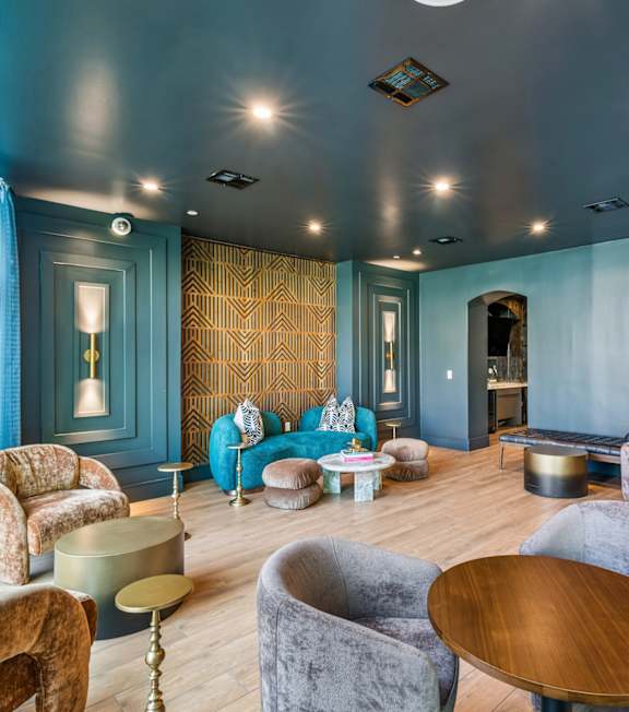 A room with a bar and chairs.