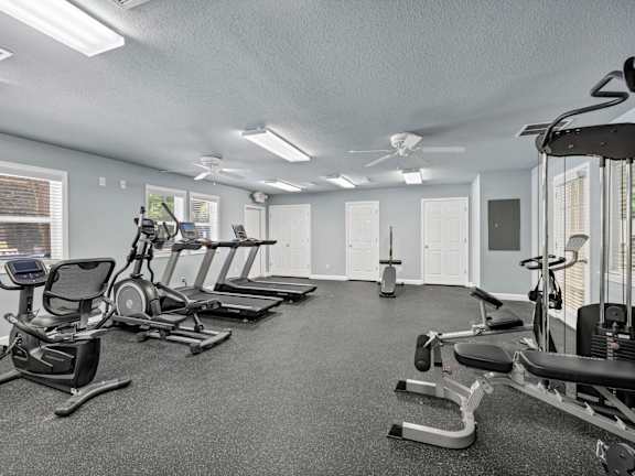 A gym with treadmills, elliptical machines, and weights.at Peachtree Place, Columbia South Carolina