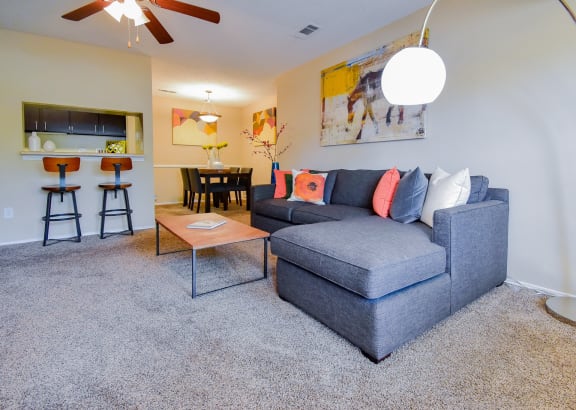 a living room with a couch and a coffee table at Riverset Apartments, Memphis, 38103