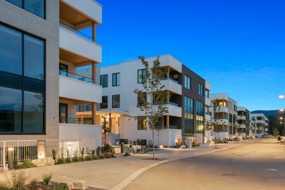 a row of modern apartment buildings on a city street
