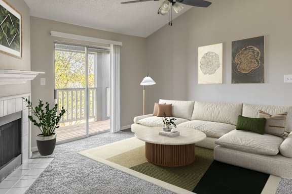 A living room with a white couch and a fireplace.