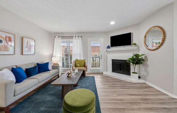 A living room with a fireplace and a couch.