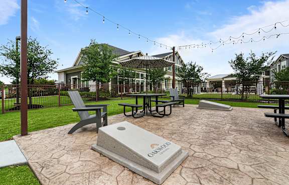 A stone monument with the word Omaha on it sits in the middle of a courtyard.
