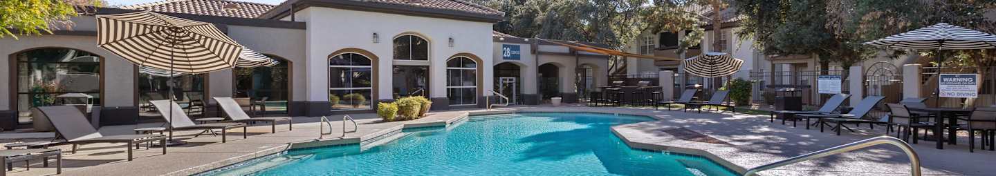 Pool and poolside area at Arcadia Cove Apartment Homes.