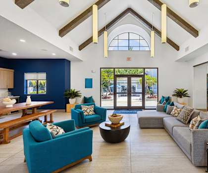 A spacious living room with a large window and a view of the outdoors.