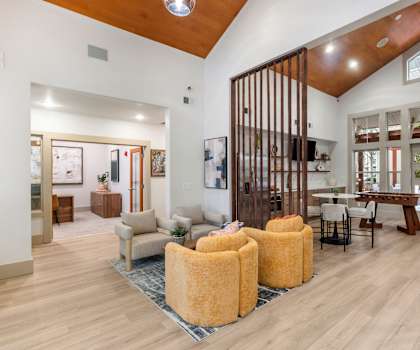 A modern interior with wooden floors and furniture.