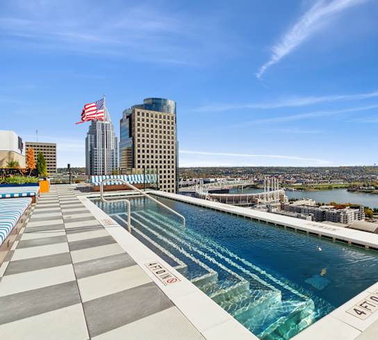 A swimming pool with a view of the city.