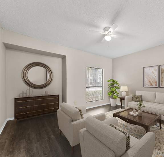A living room with a brown wooden dresser and a white couch.