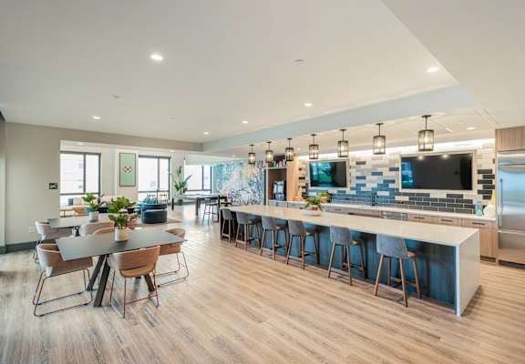 a communal kitchen and dining area in a modern home