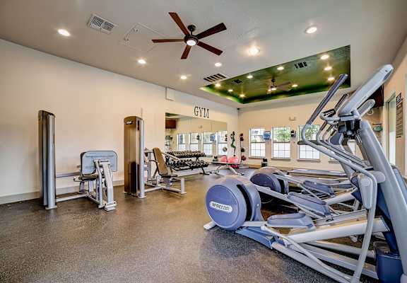 a gym with a variety of exercise equipment