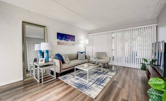 a living room with a couch and a table