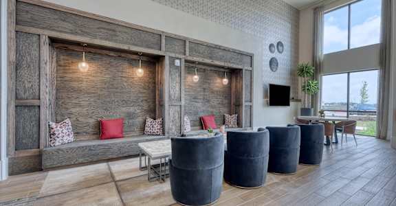 a living room with a couch and a table with chairs