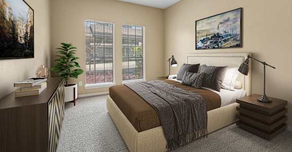 A bedroom with a large bed, a nightstand with a lamp, and a painting on the wall.