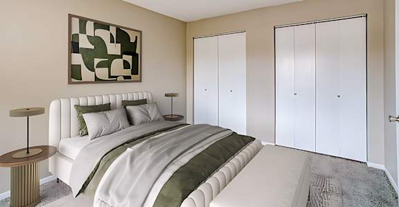 A bedroom with a large bed and a painting on the wall.