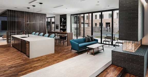Trovita Rio Apartments in Tempe, Arizona Clubhouse Lounge with Fireplace and Kitchen