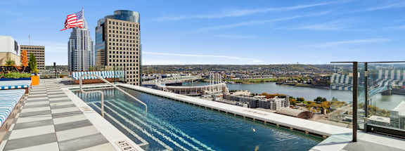 A swimming pool with a view of the city.