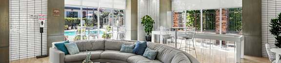 a rendering of a living room with a couch and a table
