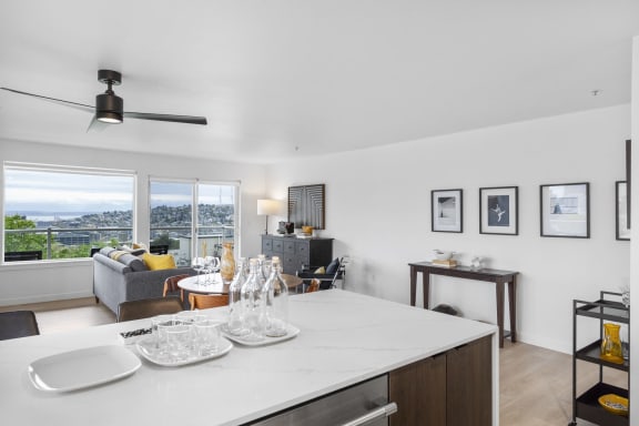 a bedroom with hardwood floors and white walls