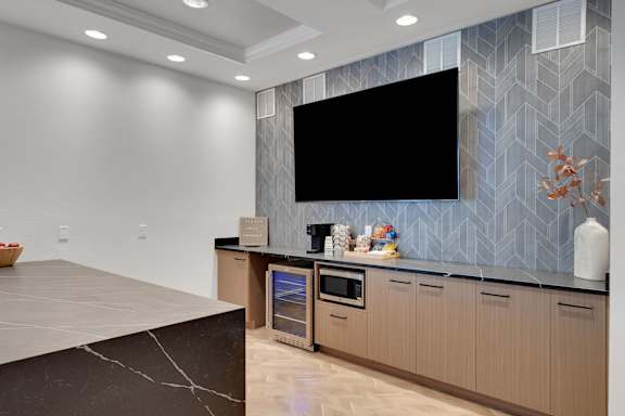 Coffee machine in clubhouse kitchen at AVIA Apartments On Alpha, Dallas, Texas