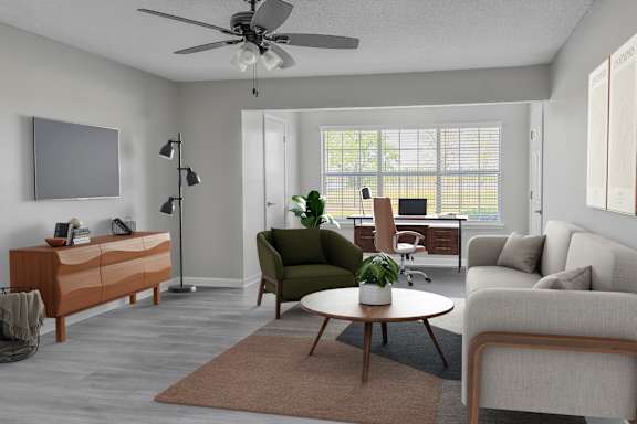 A living room with a green chair and a brown rug.