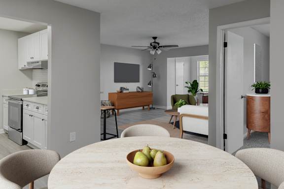 A modern kitchen with a dining table and chairs.