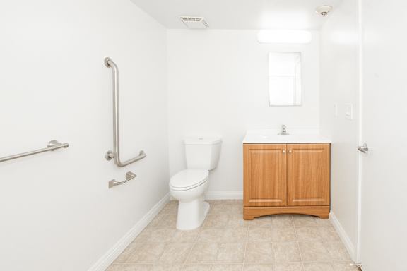 Sample Unit: Bathroom with Toilet, Sink, Grab Bars