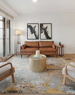 a bedroom with a bed and a chair