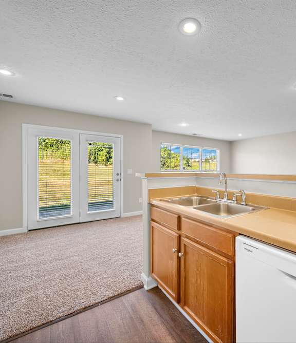 A kitchen with wooden cabinets and white appliances.