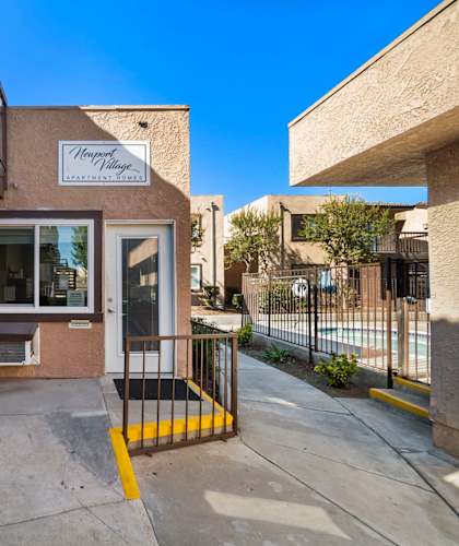 The entrance to a building with a sign that reads "Harvest House.".