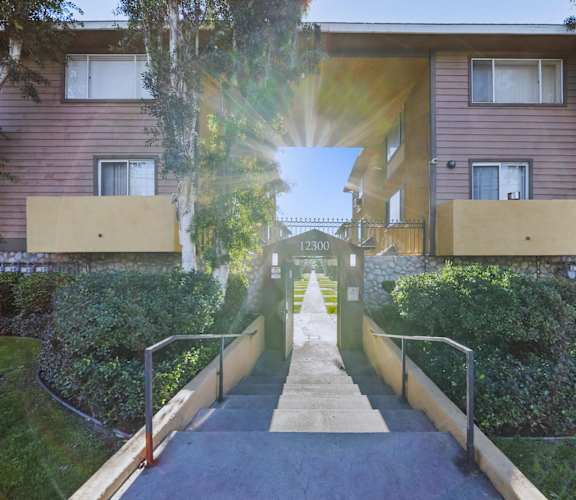 A sunny day at the entrance of a residential building.