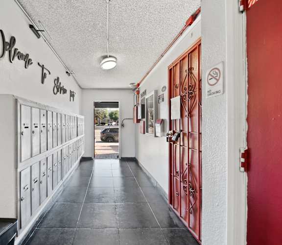 A long hallway with a sign that says "Where To Shim".