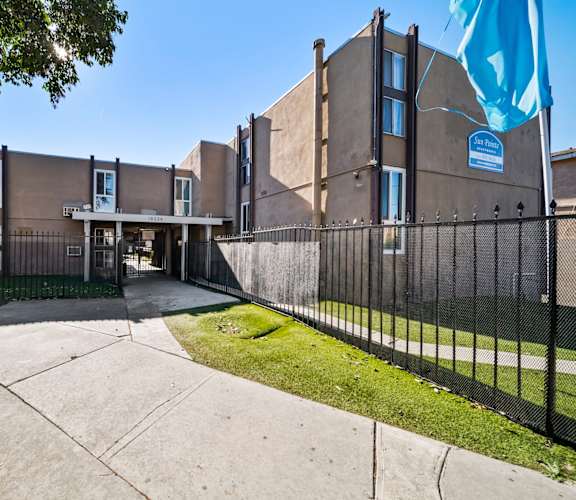 A building with a blue flag in front of it.