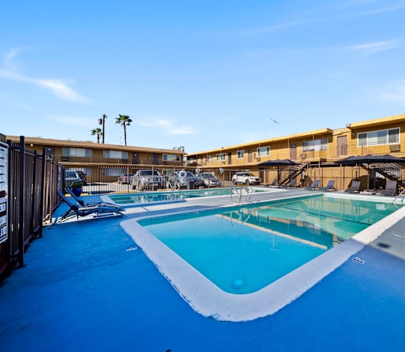 A swimming pool with a blue tinted water.