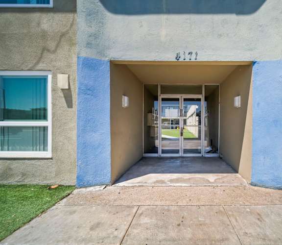 The entrance to apartment 327 is shown with a glass door and a small window on the left.