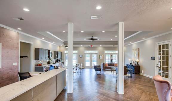 a resident clubhouse with a kitchen and living room