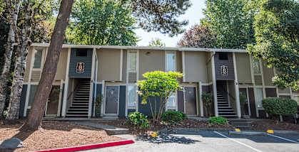 Building exterior and entryways and parking lot at Rolling Hills Apartments, Oregon, 97062