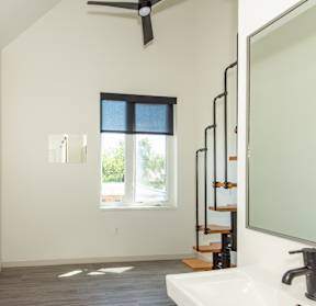 A bathroom with a window and a sink. at Society 62 Apartments, Portland, OR