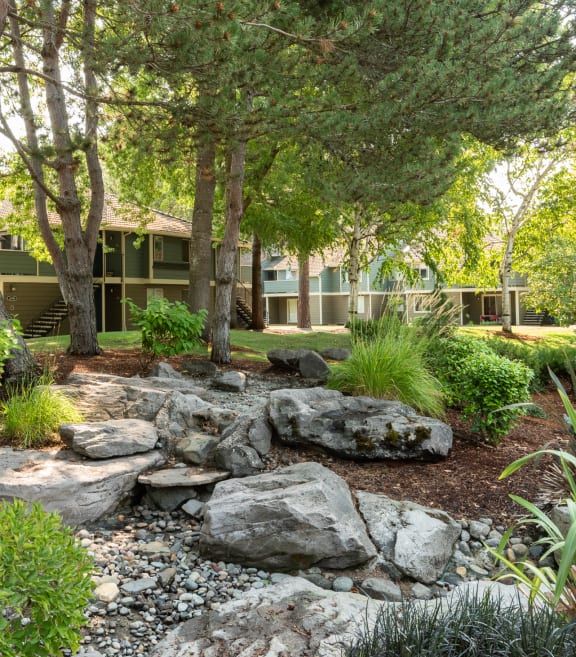 Kings Court building exterior river bed landscaping