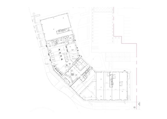 A floor plan of a building with a red line on the right side.