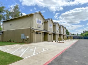 a row of houses with a parking lot