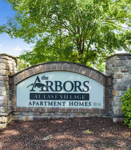 The entrance to The Arbors at East Village Apartment Homes.