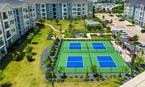 Outdoor Kitchen and Ping Pong Table at Cedar Heights Luxury Apartments in Southeast Austin, TX